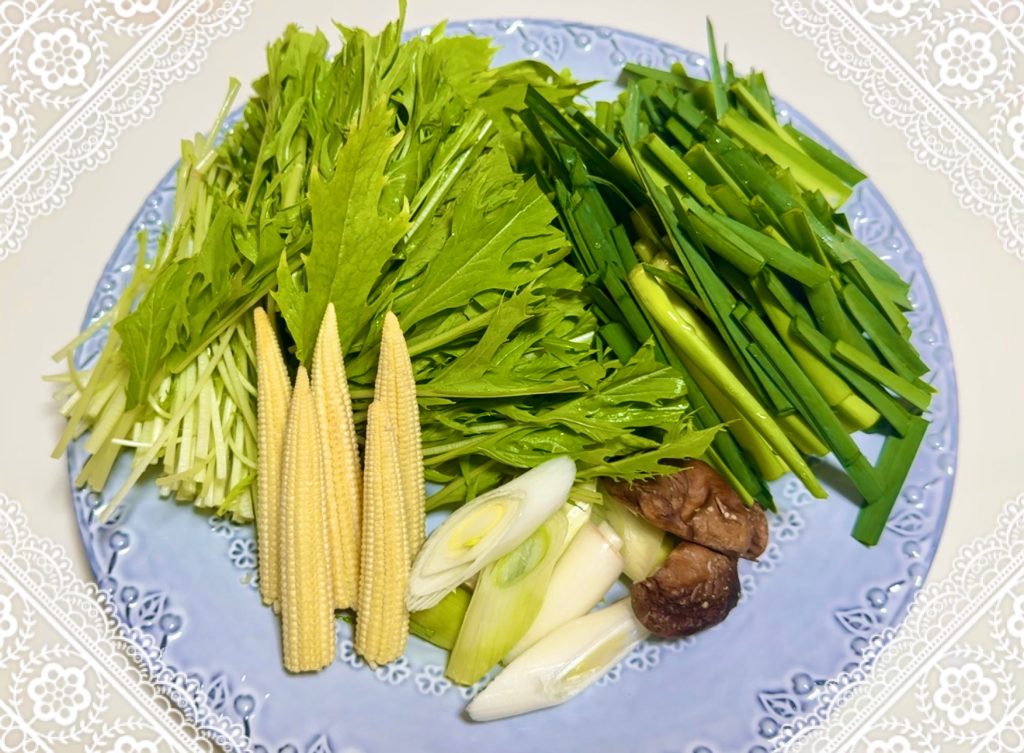 Add the vegetables to the chicken and shrimp dumpling pot last.