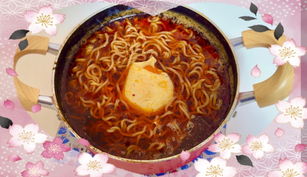 Add noodles and eggs to the spicy hotpot and enjoy the delicious meal.